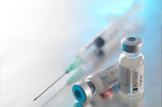 picture of vaccine bottles and a syringe